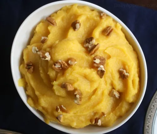 Acorn Squash Puree is a wonderful side dish or sweet edible garnish for your Thanksgiving Dinner. Sprinkle on some crunchy pecans for added texture.