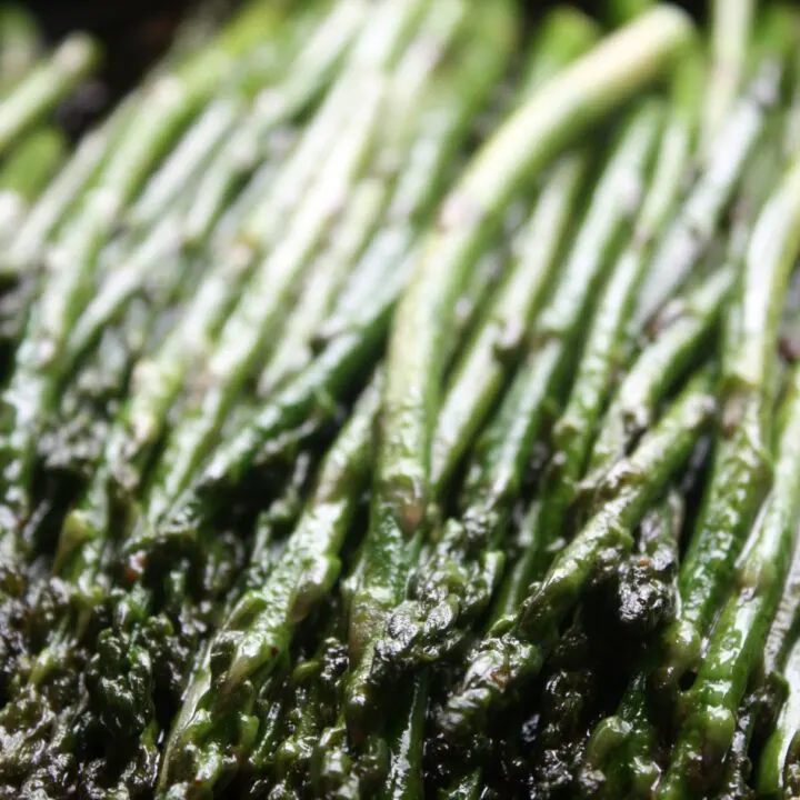 Fresh asparagus sauteed in a cast iron skillet with garlic and butter.