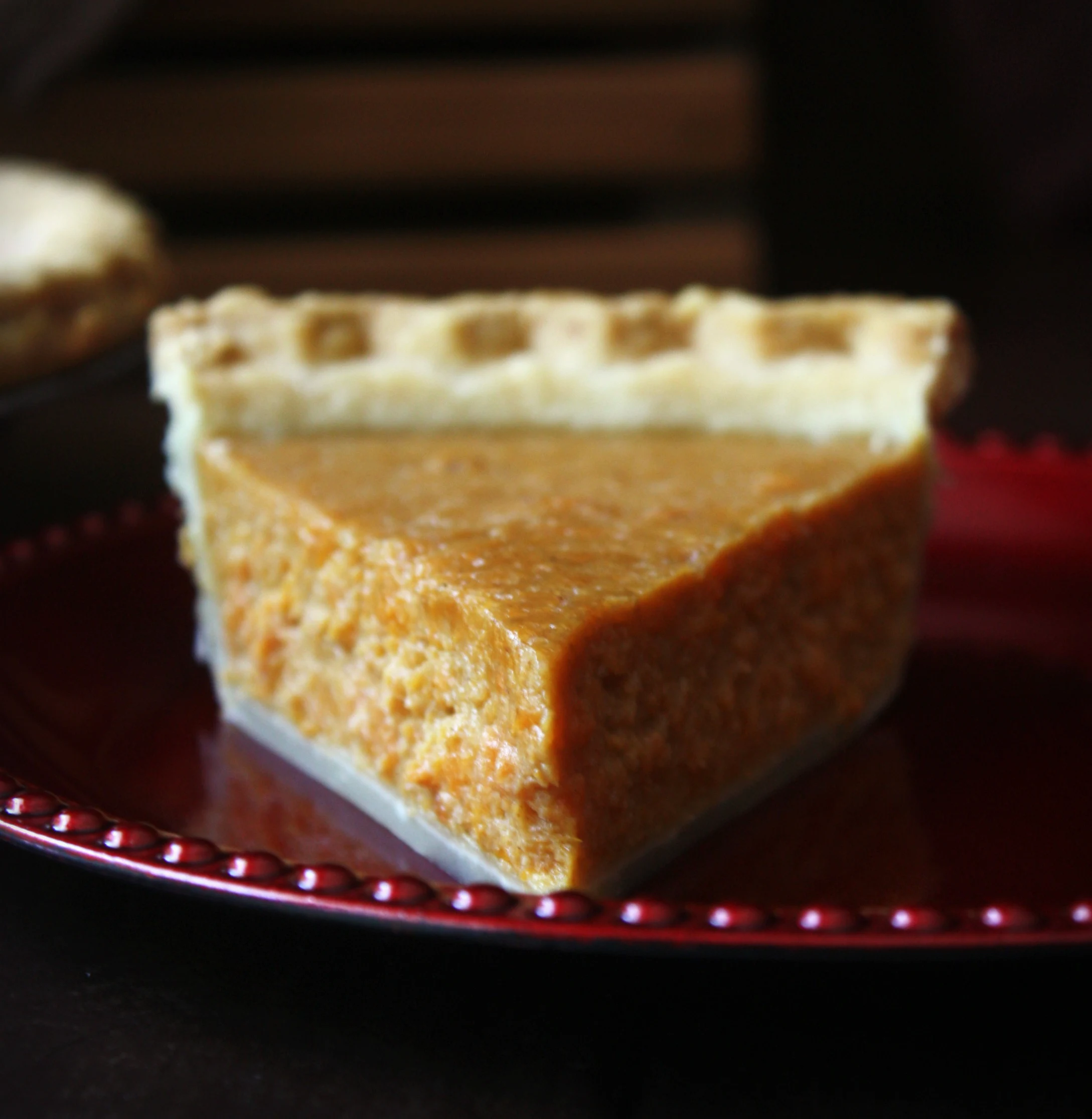 This Sweet Potato Pie is spiced with cinnamon and nutmeg with hints of vanilla and molasses. This traditional Southern dessert is perfect for Thanksgiving and Christmas holidays. 