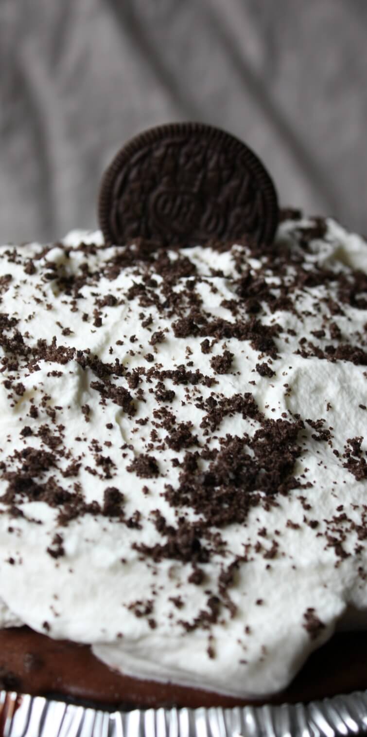 Chocolate Oreo Pie is a no bake dessert filled to the rim with chocolate pudding, mile high whipped cream and loaded with Oreo cookie crumbs.