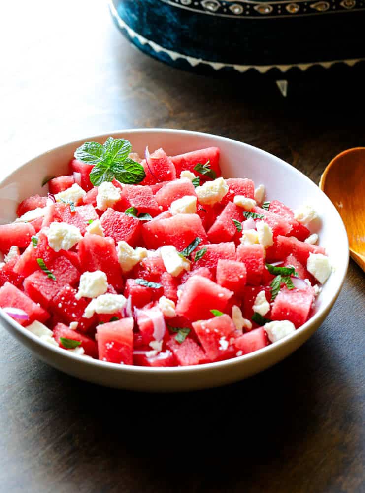 Bowl of cubed watermelon and feta with mint