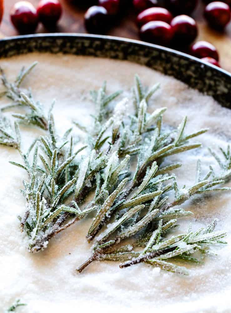 a plate with sugar and rosemary